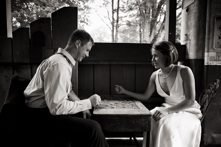 bride and groom playing checkers at story inn in brown county indiana