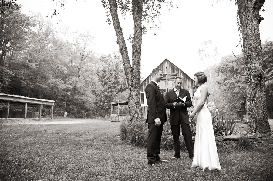 couple in front of barn at story inn wedding