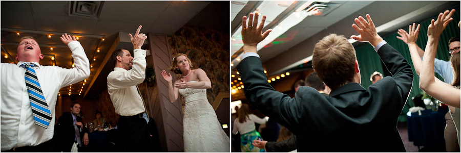 raising hands while dancing at wedding