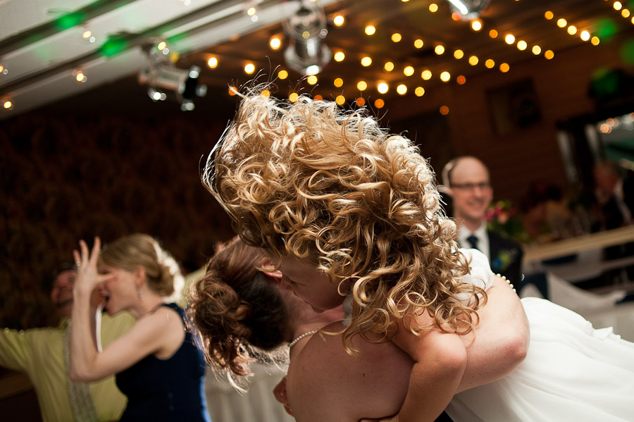 cool photo of hair flying while dancing at wedding