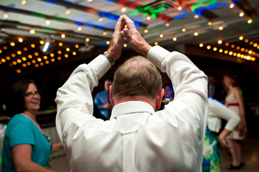 father of groom walking like an egyptian at wedding in bloomington