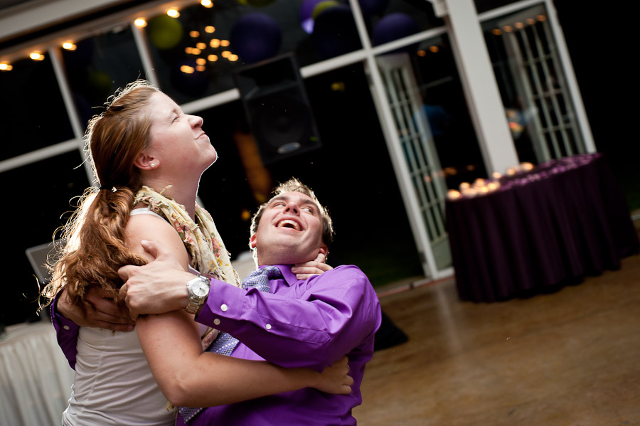 funny picture of girl dipping guy at wedding reception