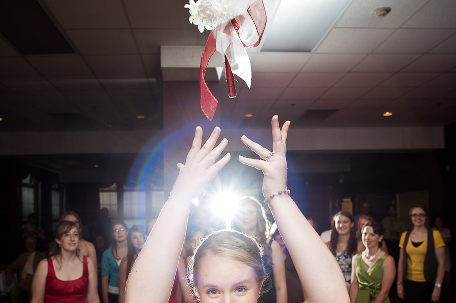 hilarious photograph of bouquet toss at wedding