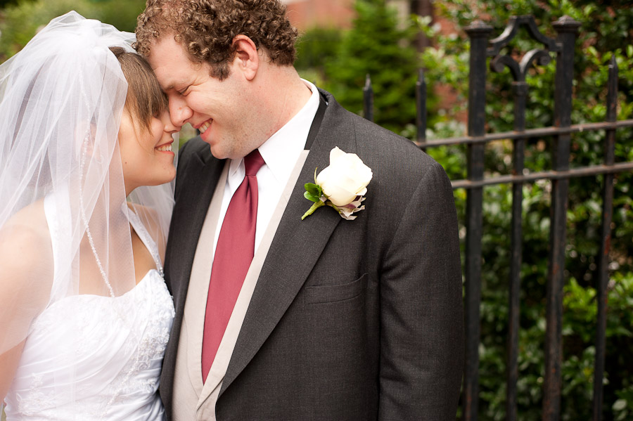 sweet moment between bride and groom immediately after wedding