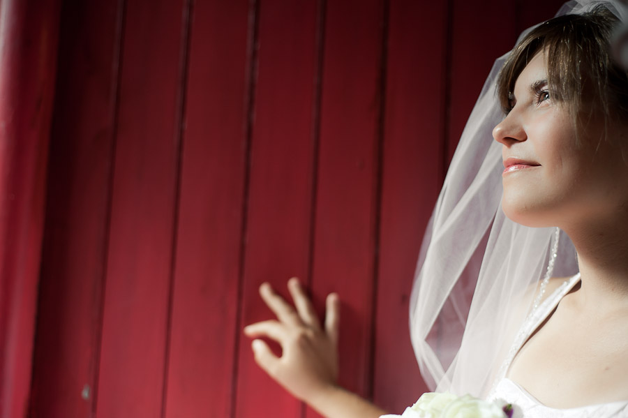 stunning bridal portrait against red wall