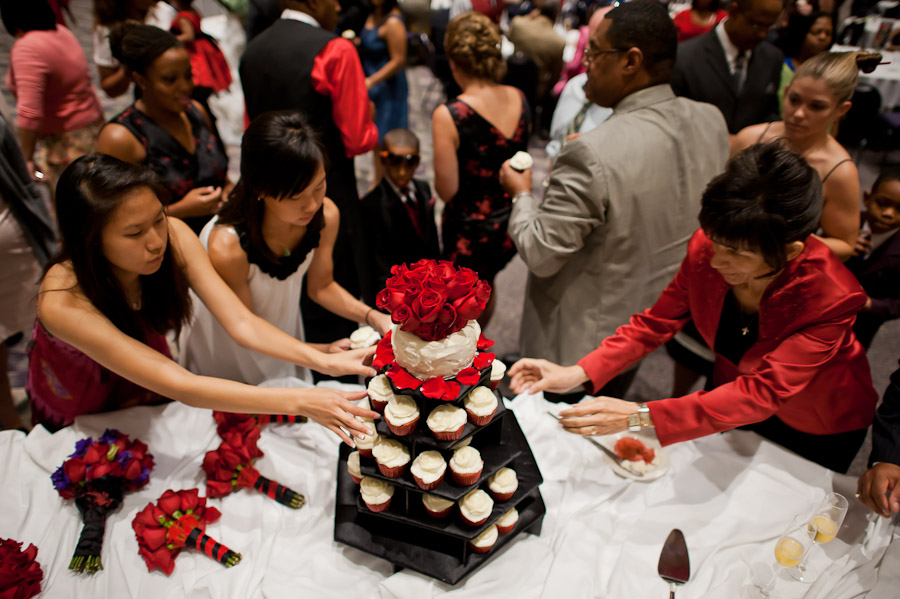 funny wedding moment of people grabbing cupcakes