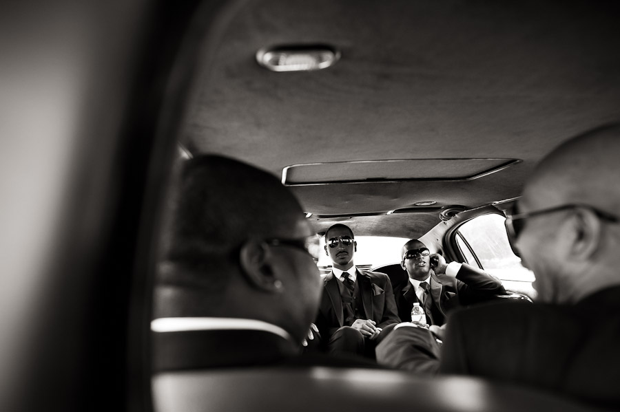 Groom and groomsmen in limo before wedding