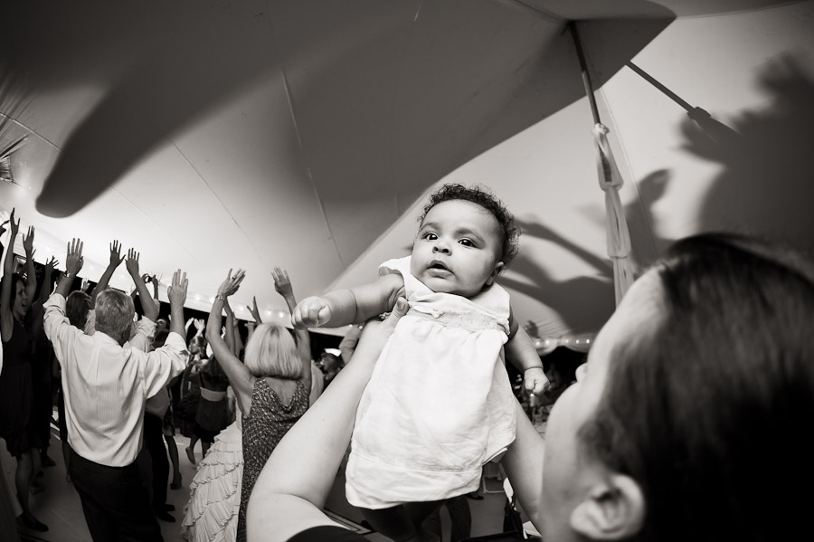 adorable baby dancing at wedding reception