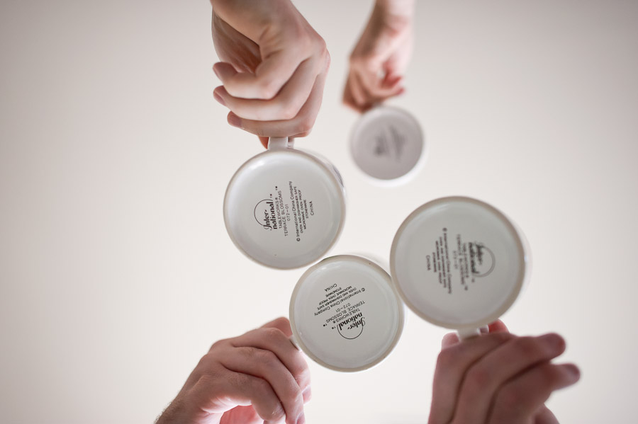 cool angle of people clinging mugs for a cheers