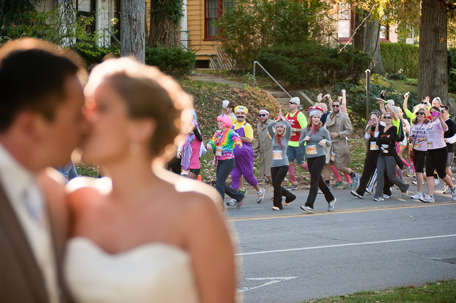 Funny Wedding Photo with Beer Run in background