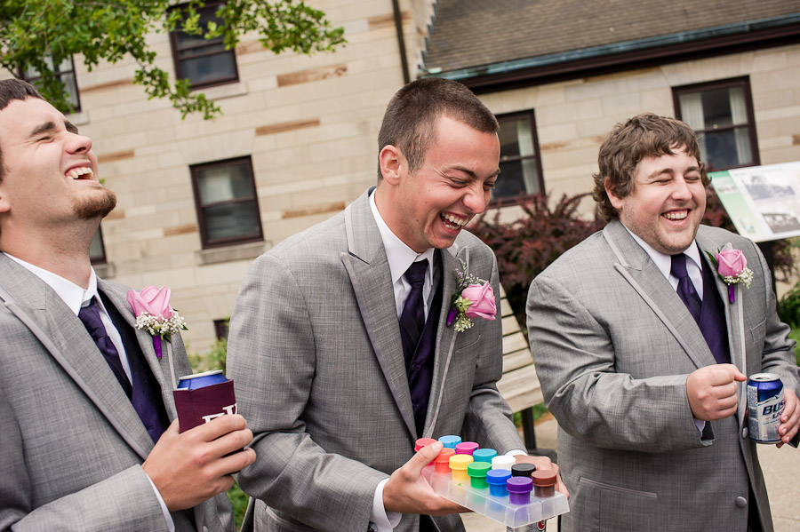 Hilarious laughter by groomsmen at wedding