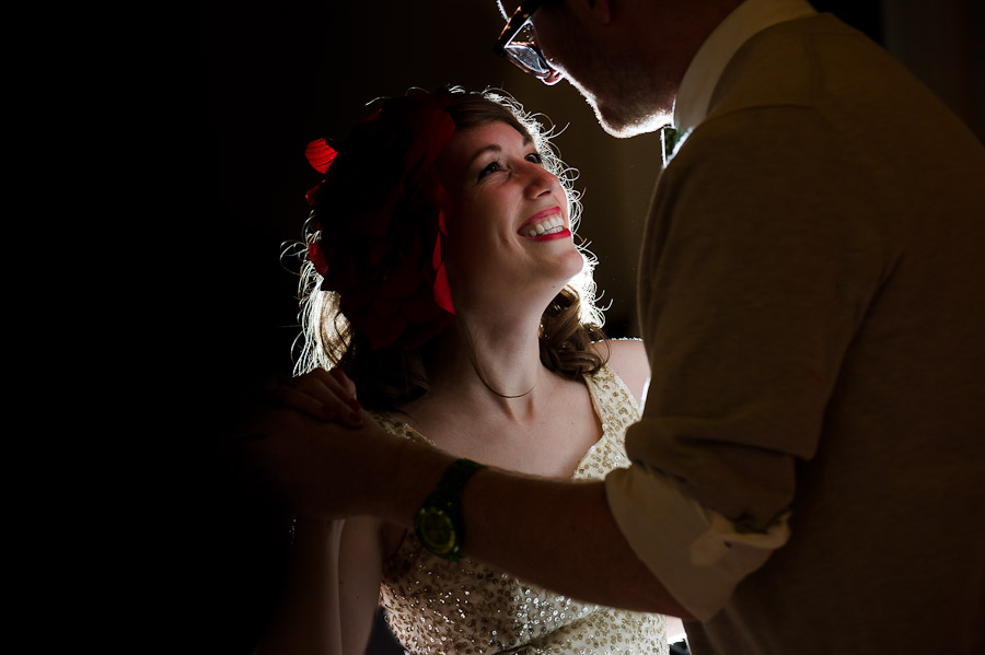 Dramatic dancing portrait of bride and groom at wedding reception