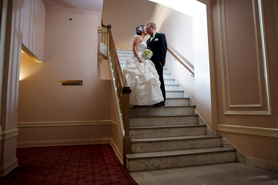 Romantic, architectural photo of bride and groom