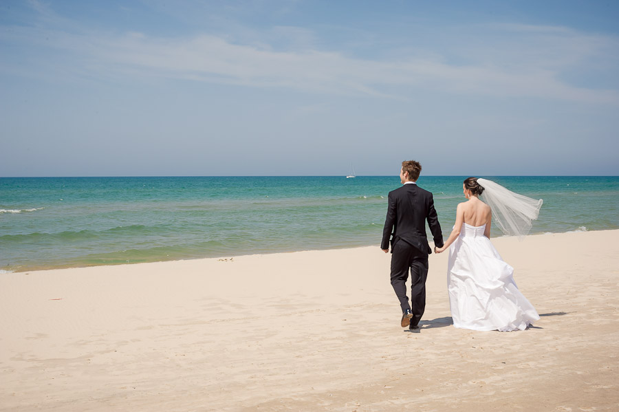 Bride and groom on beautiful, picturesque Lake Michigan