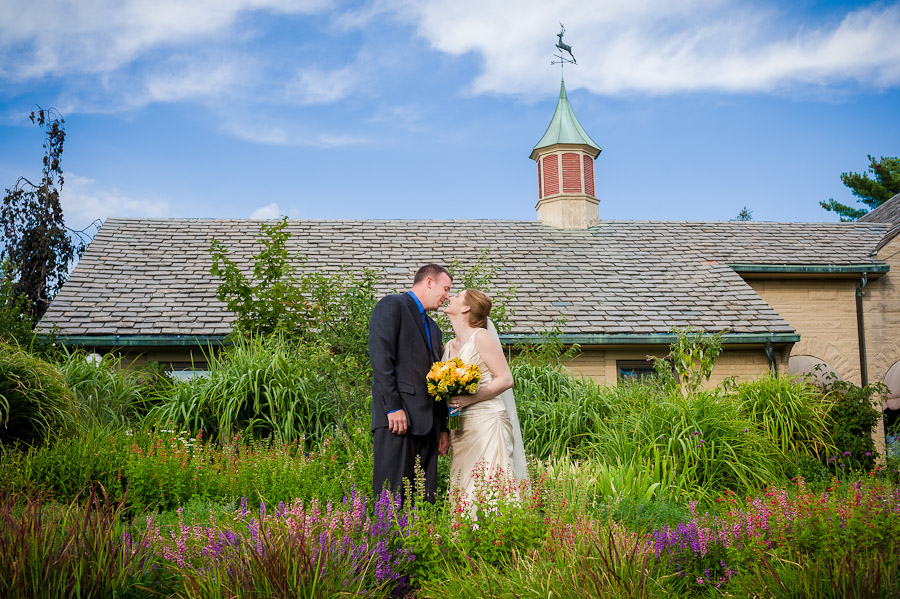 sweet wedding moment in colorful garden