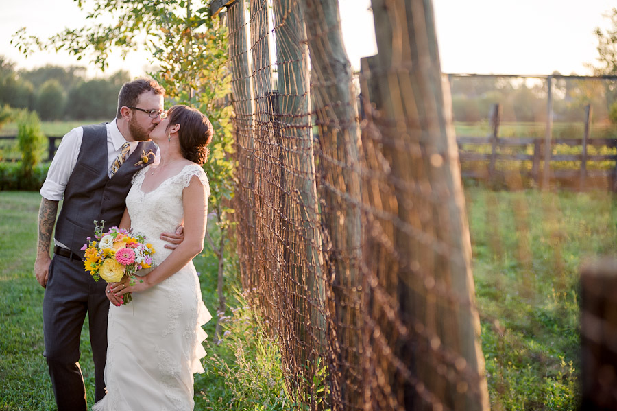 beautiful wedding photo of stylish bride and groom at farm wedding