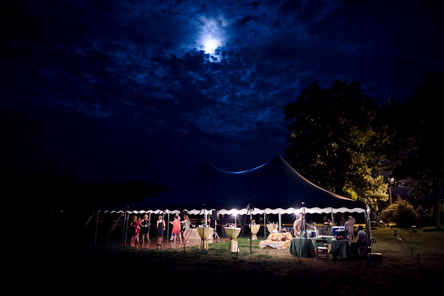 Breath-taking nighttime wedding photograph of fun and crazy dance party