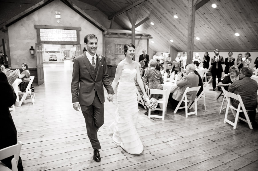 Fun and happy couple entrance photo into The Fields reception