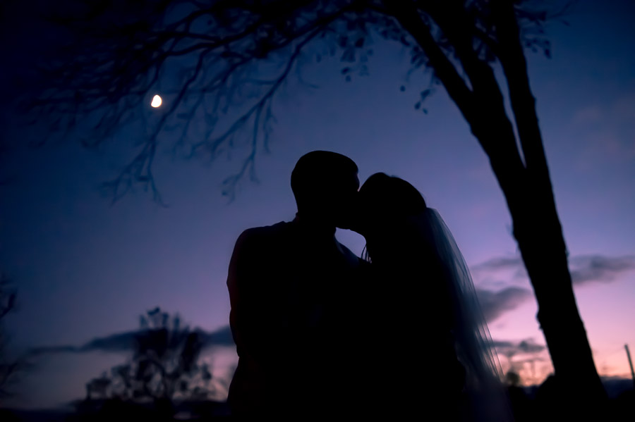 Gorgeous, artistic, sunset wedding silhouette portrait of bride and groom 