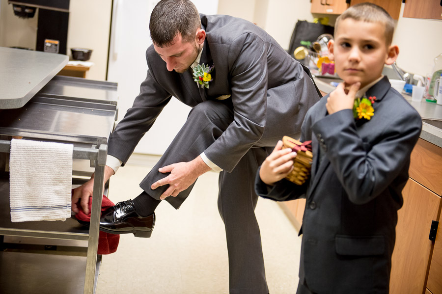 Pre-wedding shoe shine photograph at St. Agnes Church in Nashville, Indiana