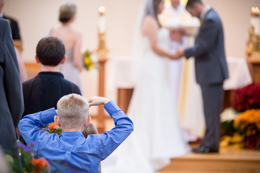 Pic of funny, cute kid watching wedding ceremony in Brown County Indiana