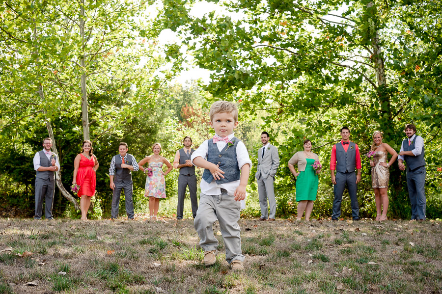 funny kid in wedding bridal party photo