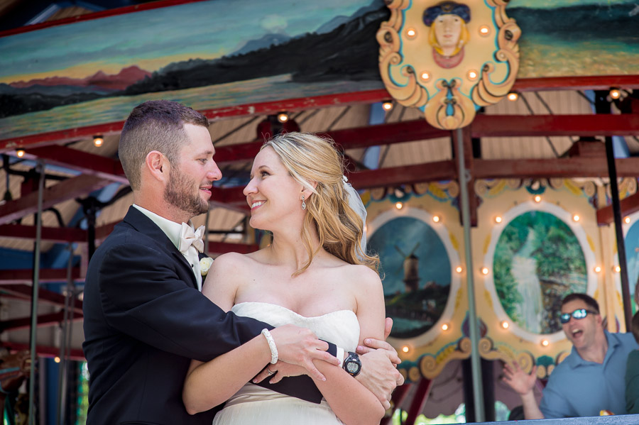 Funny passerby on carousel during wedding portrait