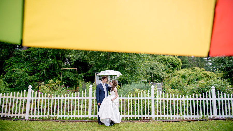 colorful rainy wedding day portraits with umbrellas