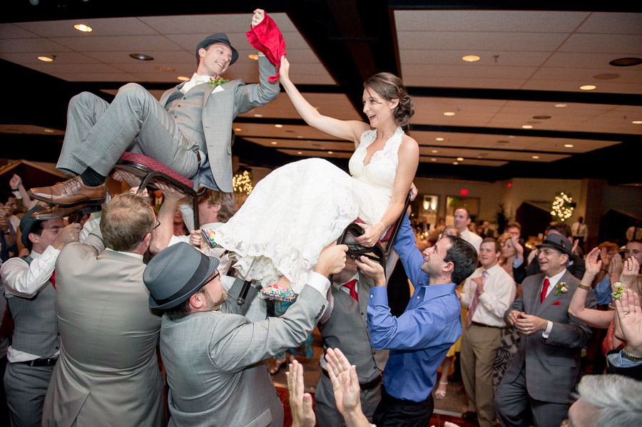 awesome and fun bride and groom photo at wedding reception during the hora