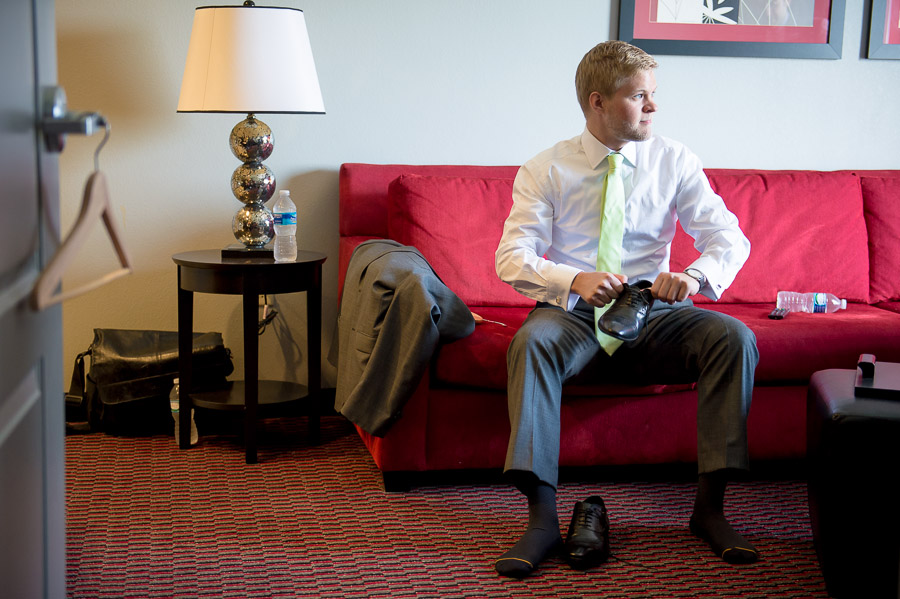 colorful, fun photo of groom getting ready for Virginia wedding