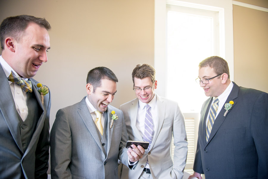 Groomsmen and groom laughing and having fun before wedding ceremony in Noblesville Indiana