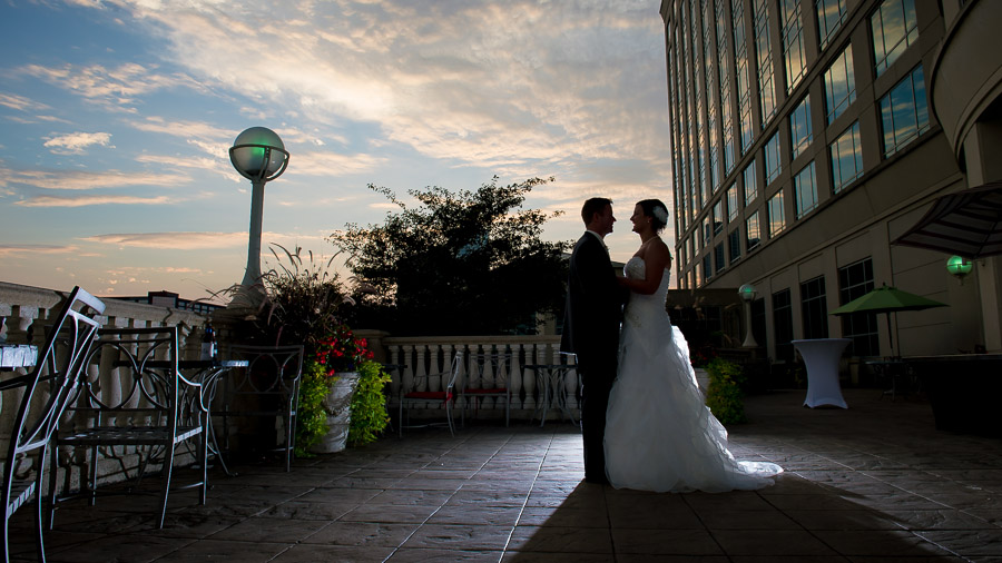 beautiful sunset photo of bride and groom on terrace at Indiana wedding