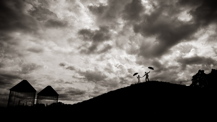 Awesome dramatic wedding portrait on rainy day by TALL+small