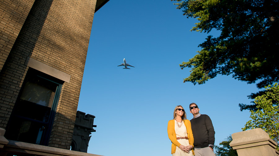 super fun engagement photo with airplane overhead in downtown Indianapolis, Indiana