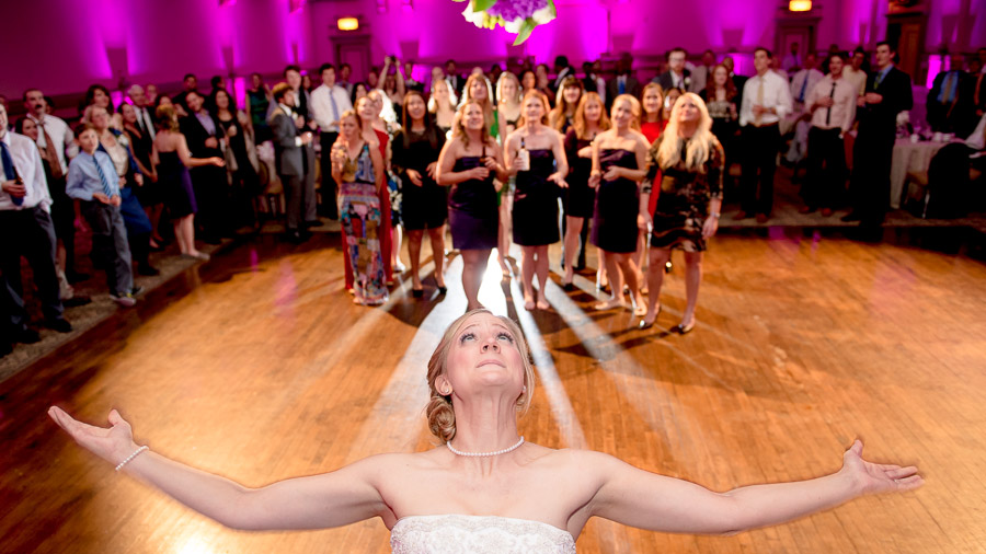 Hilarious bride throwing the bouquet photo at Richmond, VA wedding