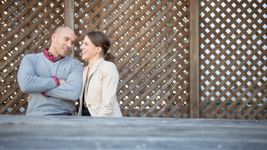 Happy, sweet, engaged couple in downtown Bloomington, Indiana