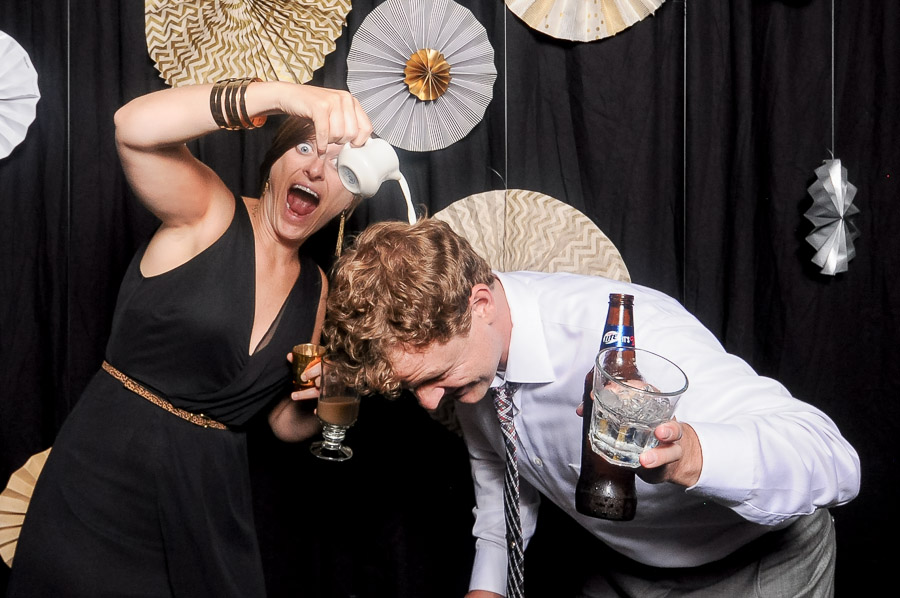 Hilarious, silly, wacky photobooth photo of dude getting creamer poured on his head at Louisville, KY wedding