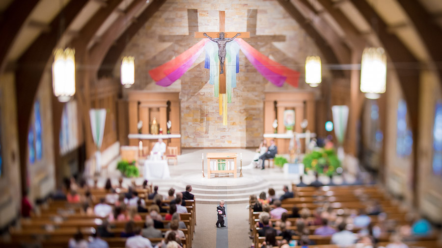 Cute little kiddo wandering around during ceremony at Indianapolis wedding.