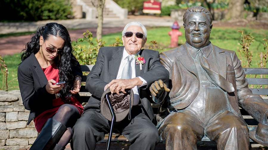 Portrait of wedding guests with Herman B. Wells statue on IU campus by TALL + small Photography