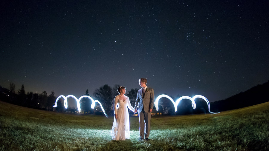 Dramatic, starry night, light painting portrait of bride and groom at King Family Vineyard winter wedding