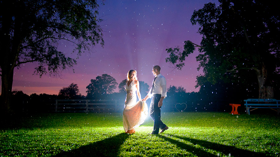 Breathtaking, colorful, nighttime wedding portrait at Sycamore Farm in Bloomington by TALL+small Photography.