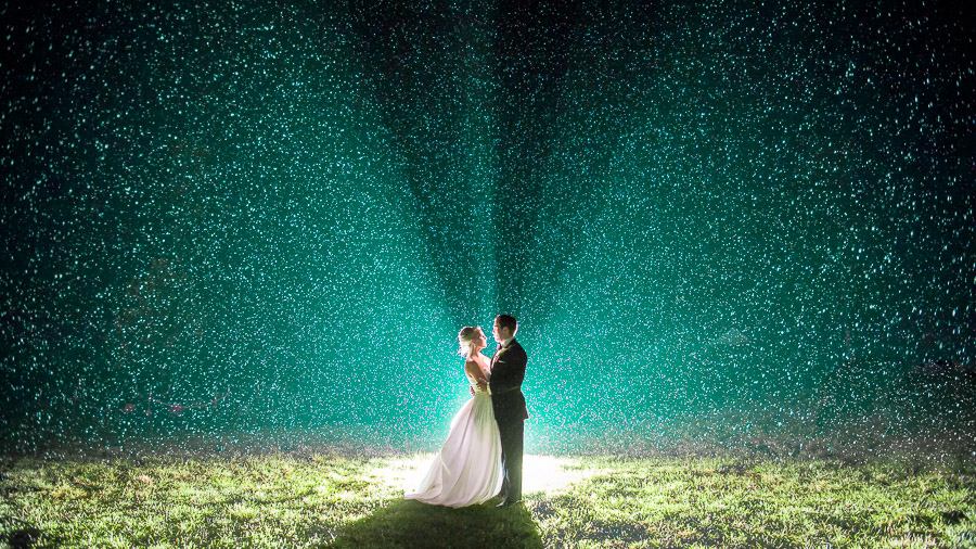 Stunning backlit rainy nighttime wedding portrait at Virginia wedding by Tall and Small Photography