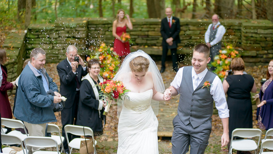 Bride and groom exit with rice toss at outdoor, Fall, state park wedding 