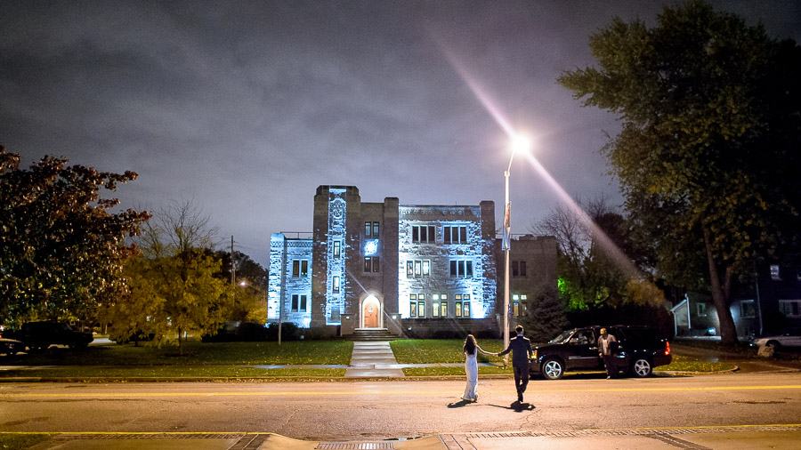 Sweet bride and groom exit at Butler University wedding