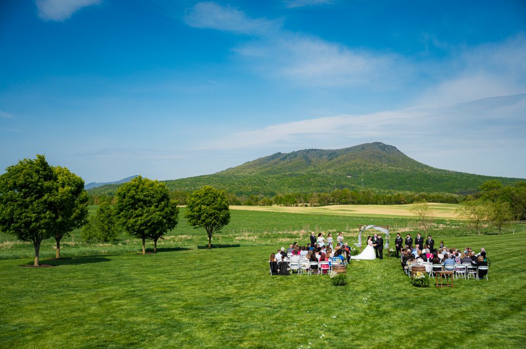 Massanutten Mountain behind the wedding ceremony at Cross Keys Barn in Rockingham County, VA