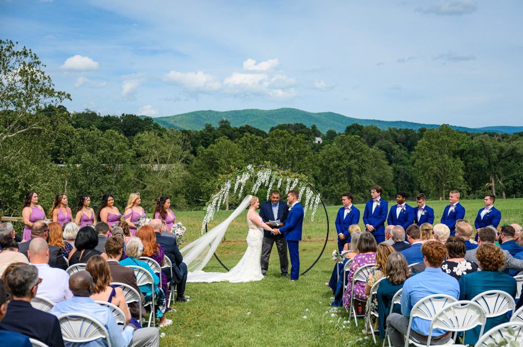 Couple at circular flower arbor from their Rivercrest wedding photos in Elkton, VA