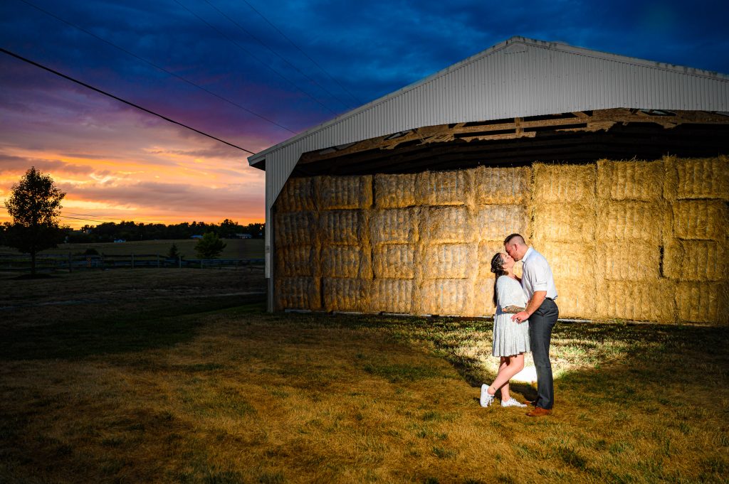 Couple standing next to the hay barn at their Cross Keys Barn Wedding Photography Rockingham County Virginia