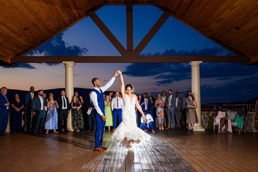 Couple dancing on the terrace at sunset at their Irvine Estate Wedding