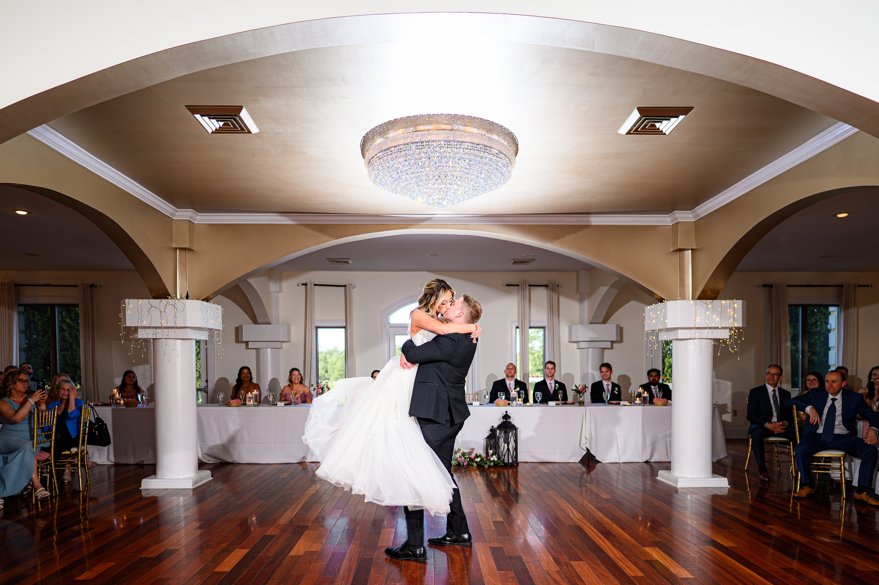 Groom lifting bride at first dance at CrossKeys vineyards wedding