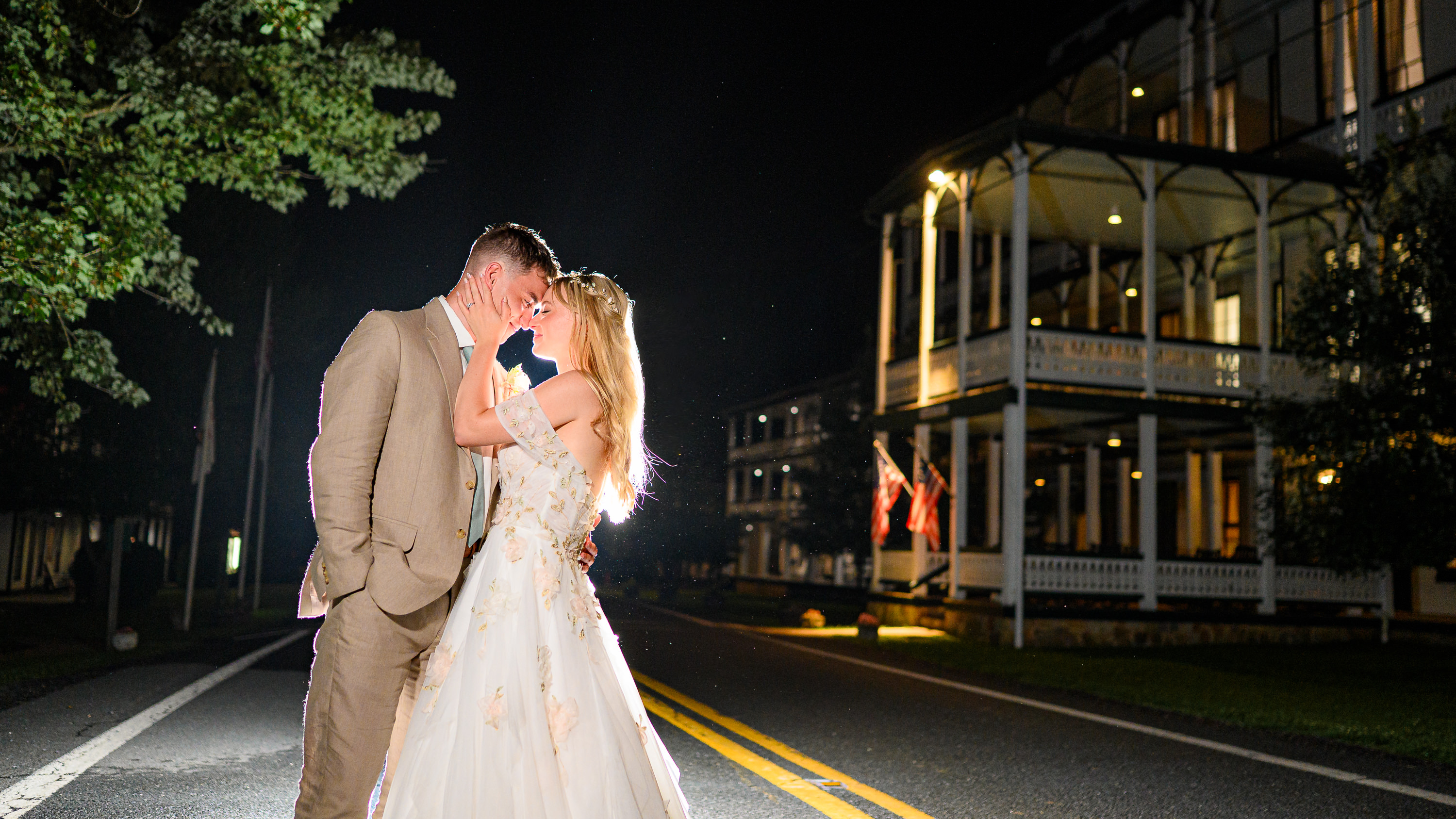 Nighttime portrait of couple in front of Virginia House at Shrine Mont